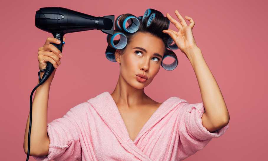 Woman Blow Drying Hair