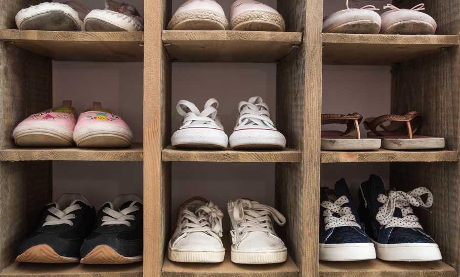 shoe storage rack holding many pairs